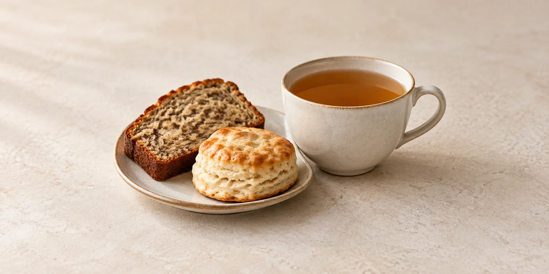 Throat Coat herbal tea with banana bread and a plain biscuit
