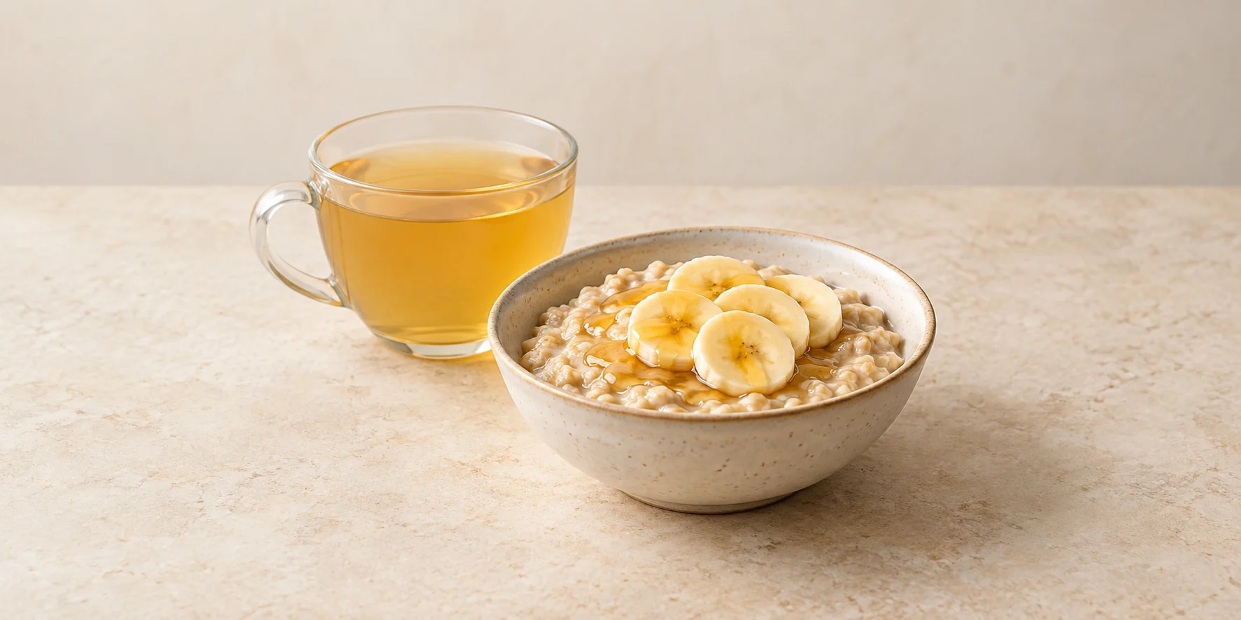 Ginger tea with oatmeal topped with honey and banana