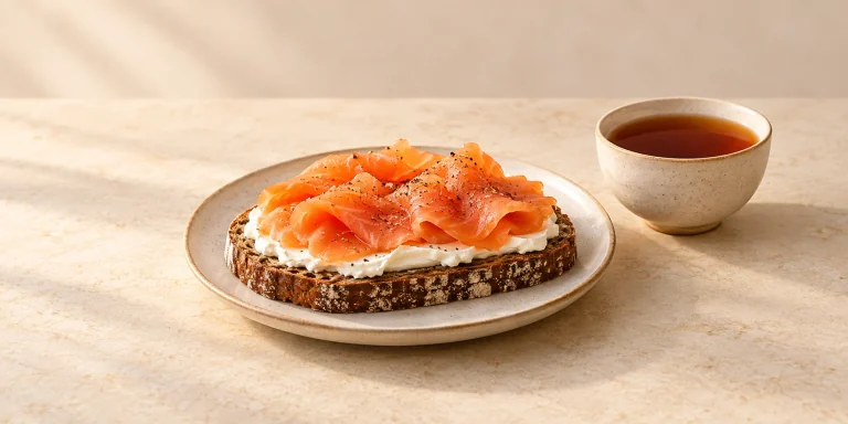 Lapsang Souchong tea with smoked salmon and cream cheese on rye bread
